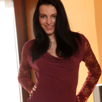 Long legged glamour girl Sapphira A on knees baring tight ass bald pussy