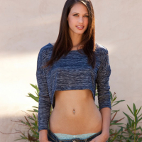 Tiffany Thompson pulls down her jeans to show off her nice rump