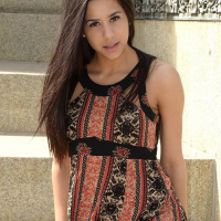 Brunette teen Bella teases in her dress on the steps