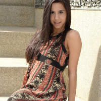Brunette teen Bella teases in her dress on the steps