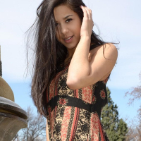 Brunette teen Bella teases in her dress on the steps