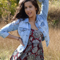 Brunette beauty Bella Quinn poses for you in the field