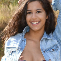Brunette beauty Bella Quinn poses for you in the field
