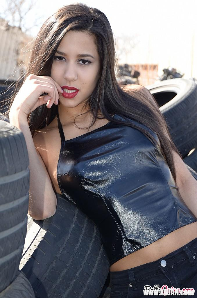 Brunette coed Bella Quinn teases at a tire yard - Photo #2553248
