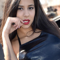 Brunette coed Bella Quinn teases at a tire yard