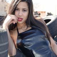 Brunette coed Bella Quinn teases at a tire yard