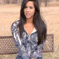 Brunette teen Bella Quinn teases on the bench outside
