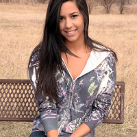Brunette teen Bella Quinn teases on the bench outside