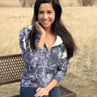 Brunette teen Bella Quinn teases on the bench outside