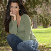 Brunette teen Bella Quinn teases and poses in the tree
