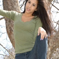 Brunette teen Bella Quinn teases and poses in the tree