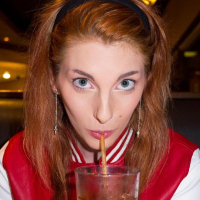 Redhead teen Lilith Lust teases in her college uniform
