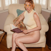 Redhead beauty Lilith Lust shows off her long sexy legs in public