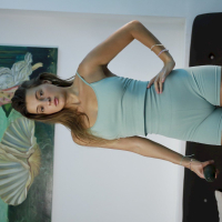 Sweet Melena Maria Rya wearing a short dress while eating