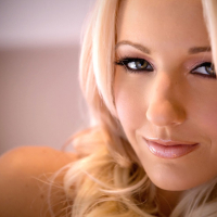 Cody Love on her bed stripping Lingerie and Stockings