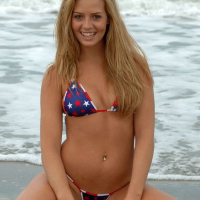 Shannon wades into the water in her blue bikini