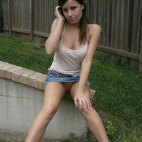 Pictures of Ashley Brookes showing off her long legs outside