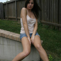 Pictures of Ashley Brookes showing off her long legs outside