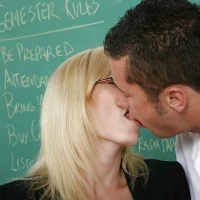 Lewd teacher Holly Sampson seduces her student and plays with his big cock