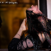 Jenevieve Hexxx poses with snakes as a dancer and at the ED awards