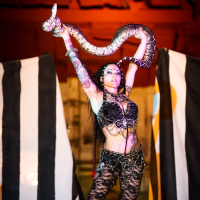 Jenevieve Hexxx poses with snakes as a dancer and at the ED awards