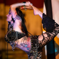 Jenevieve Hexxx poses with snakes as a dancer and at the ED awards