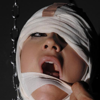 Mummified sex slave Leyla Black having mouth filled with spit in BDSM scene
