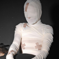 Leyla Black is mummified and spanked pussy exposed
