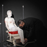 Leyla Black is mummified and spanked pussy exposed