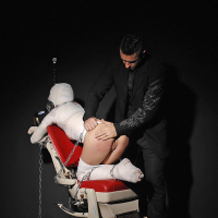 Leyla Black is mummified and spanked pussy exposed