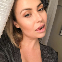 Beautiful busty milf Ava Nicks is teasing by flashing her huge boobs on bed