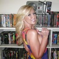Milf Dylan Riley is smiling on camera and playing with her boobies