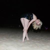 Blonde coed Catie Parker has some fun on a beach at night