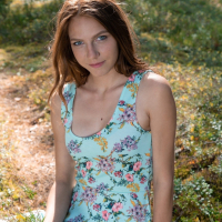 Polly is outside in her forest in her blue dress She teases the camera to show her pink panties and has fun Off comes her clothes as she relaxes on her blanket and then as she stands in the sunshine