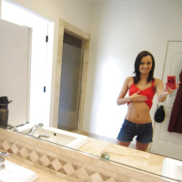 Teen babe Mimi Rayne does some sexy self shot while naked in her room