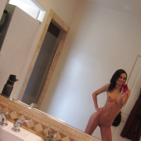Teen babe Mimi Rayne does some sexy self shot while naked in her room