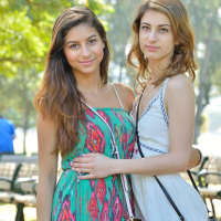 Hot teens Nina and Kristen pleasure each other outside at a park