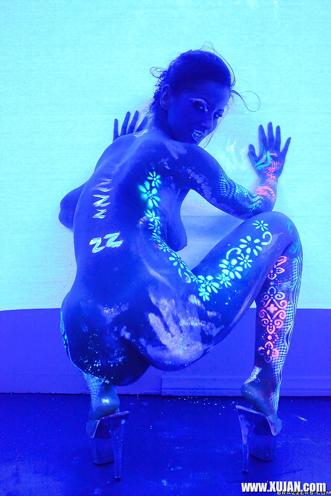 Angel Dark has her sexy booty and tits prettified with glowing bodyart - Photo #2843969
