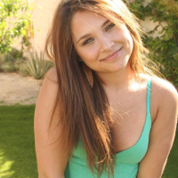 Lili Jensen teases outside in green top and thong
