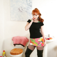 Aged redhead woman by name of Red posing for naughty hose and boot pics