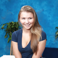 Teen Melissa is playing with her nice naked body on the table