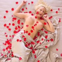 Sexy Trixie Swallows covers her nude Body in Roses