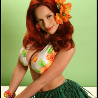 Busty Redhead Bianca Beauchamp Stripteases in a Hula Skirt and Flashes Her Big B