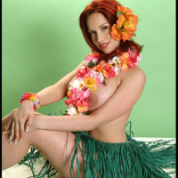 Busty Redhead Bianca Beauchamp Stripteases in a Hula Skirt and Flashes Her Big B