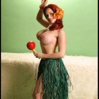 Busty Redhead Bianca Beauchamp Stripteases in a Hula Skirt and Flashes Her Big B