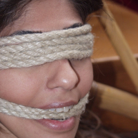 Amateur Indian beauty is tied to a wicker chair using strict rop