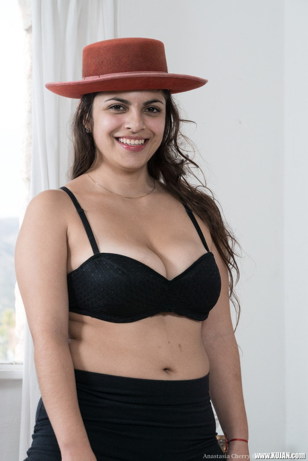 Anastasia Cherry is in her black lingerie but wearing a new red hat She starts stripping naked and then lays back to show off a hairy bush She tugs on her hairs and loves her hairy body - Photo #2999232
