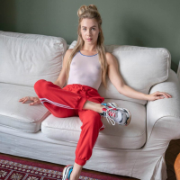 Photo session with skinny Alecia Fox posing on the white sofa