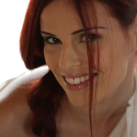 Beautiful redhead babe Susana Melo exposing all natural tits