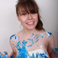 Hot curvy girl Georgina Gee gets her huge tits messy with blue paint